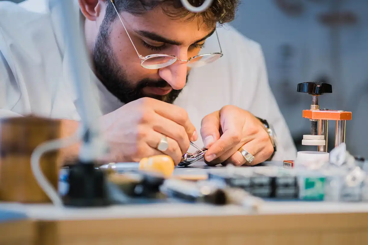 Magd Haddad working on a watch